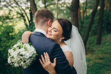 Happy bride on a walk in the park