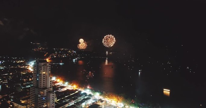 Aerial drone view of fireworks above the city on New Year's Eve - video in slow motion