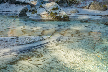 Sill’s pattern created by flowing water of river Sarca in Val Genova next to the Cascate Nardis seen on a sunny spring day, Trentino, Italy, Europe