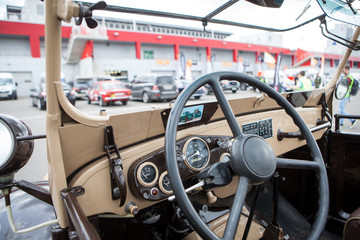 The interior of the Soviet retro car dashboard with a steering wheel