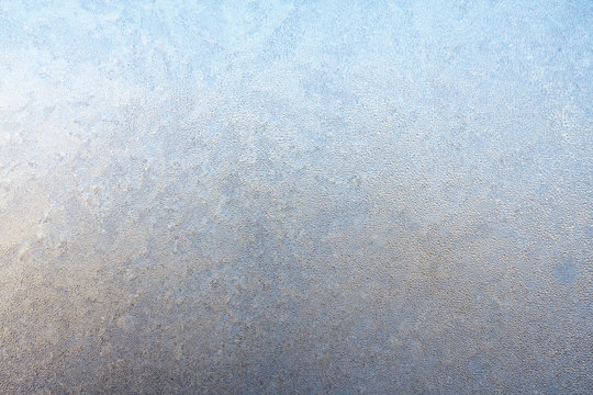 Frost on window glass close up abstract background photo texture