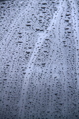 water droplets on surface of car