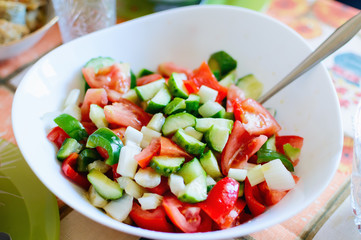 Salad of fresh tomatoes and cucumbers. Homemade natural food.