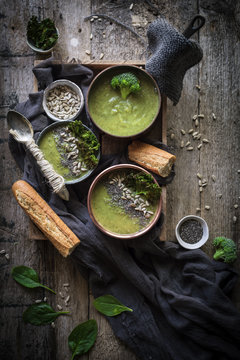 Overhead view of green soup with broccoli