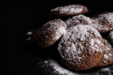 oatmeal cookies on a black table in castor sugar