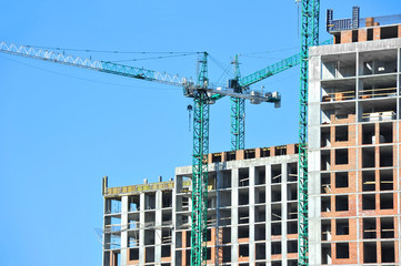 Crane and highrise construction site