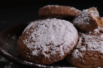 oatmeal cookies on a black table in castor sugar