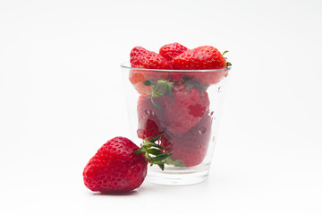 Strawberries in a glass on white bakcground 
