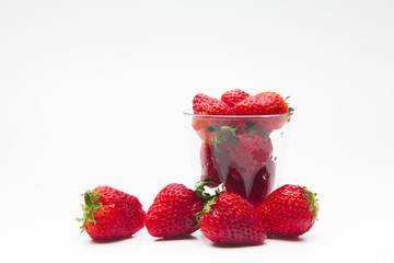 Strawberries in a glass on white bakcground 
