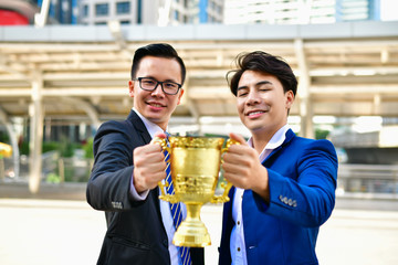 Concept business people, Young business man are competing for wins and trophies.