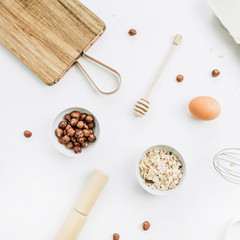 Flat lay, top view of raw healthy food ingredients on white background. Cooking concept.