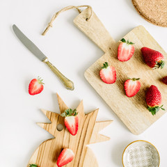 Fototapeta na wymiar Healthy breakfast with raw strawberry on cutting board on white background. Flat lay, top view.