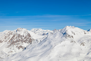 Fototapeta na wymiar Winter panorama of snowy mountain ridge in 3 Valleys skiing, snowboard resort, Alps, France
