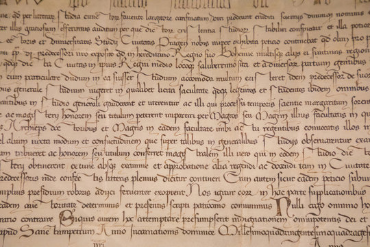 Old text in medieval bookas background, Europe