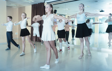 Children learn dance movements in dance class