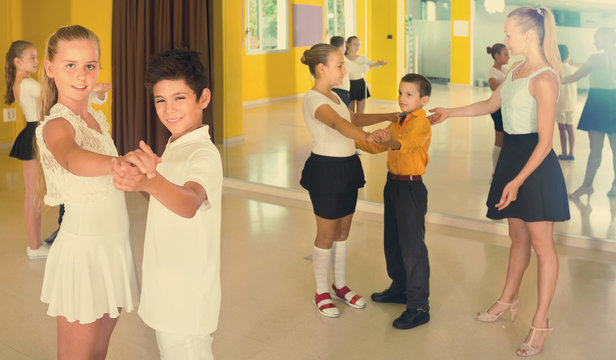 Group of  children dancing tango in dance studio