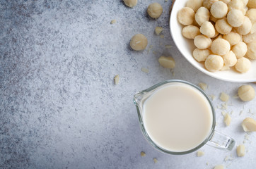 Obraz na płótnie Canvas Macadamia milk on a light stone table
