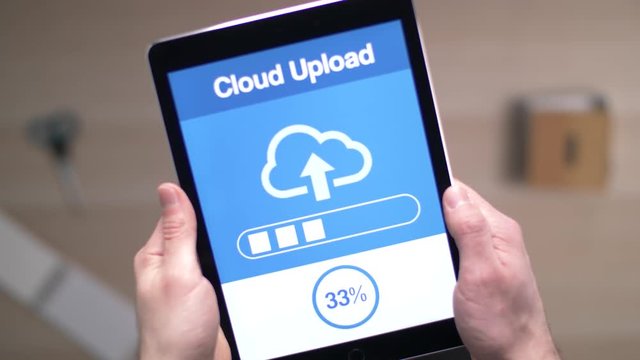 Uploading data to the cloud with a tablet device.