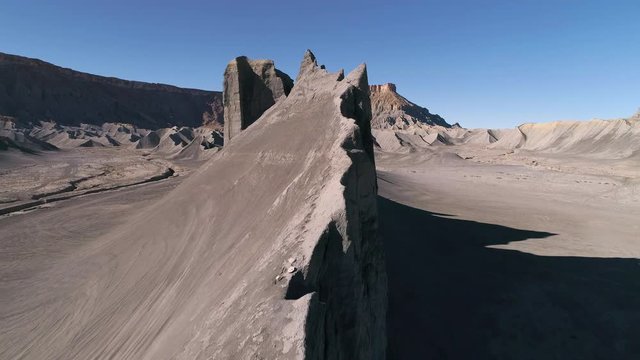 Aerial view of jagged rocky hill in Swing Arm City an ATV off road area near Caineville Utah in the desert.