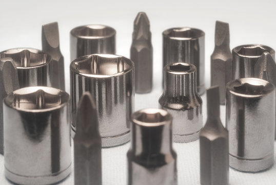 End head tool socket wrenches spanner and set screwdrivers standing in a circle on a white background
