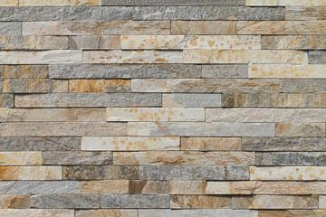 Natural shale. A sample of the wall covering with natural stone. Background.