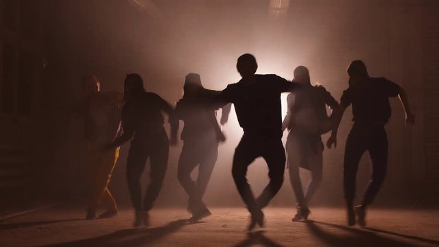 Six Caucasian rappers are performing on the street. unforgettable presentation.