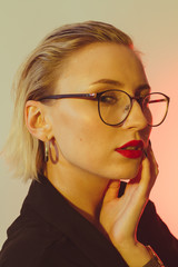 Portraits of a beautiful and elegant girl with red lipstick and wet hair