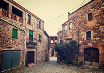 Fototapeta na wymiar Old street in Catalan village. Pubol