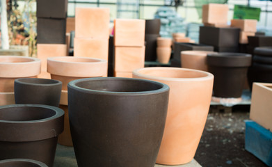 Image of rows with clay pots for flowers