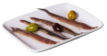 Photo of sprats with olives on the plate