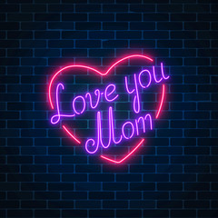 Happy Mothers Day neon glowing festive sign on a dark brick wall background. Love you mom in heart shape.