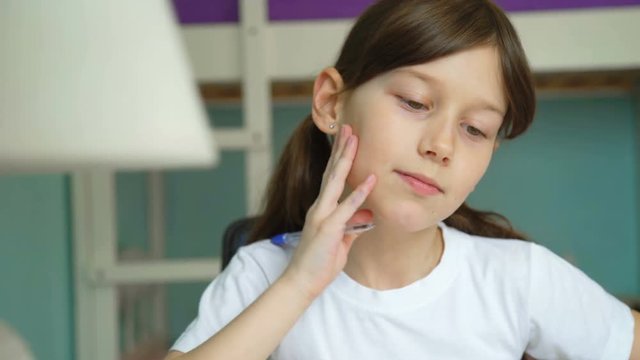 girl learning lessons homework. pupil emotions studying at home. good mood, moving to rhythm