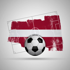 Latvia flag soccer background with grunge flag, football pitch and soccer ball