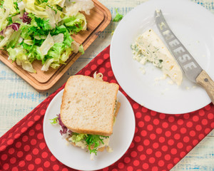 Vegetarian sandwich with salad and blue cheese on a wooden background. Healthy Diet