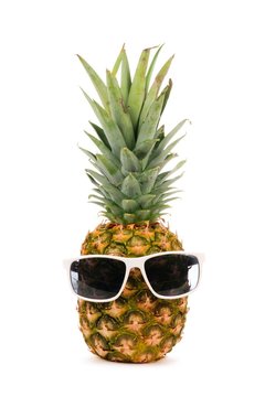 Hipster pineapple with trendy sunglasses isolated on a white background