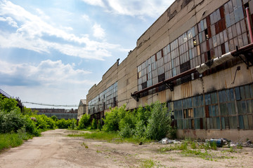 Fototapeta na wymiar The abandoned old factory building outside 