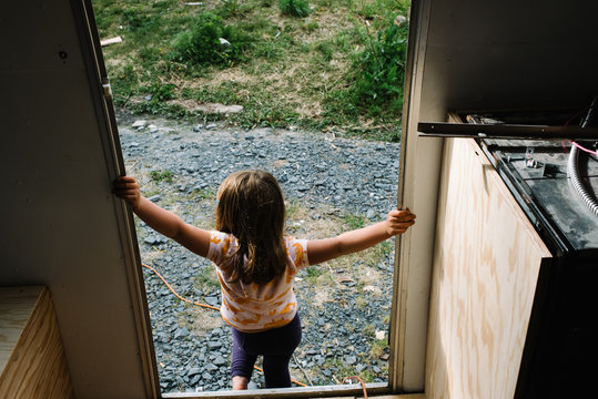 Young girl leaving camper