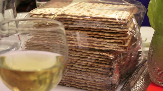 Matzah, lettuce leaves, wine are traditional elements of the celebration of the Jewish Easter holiday - Petsakh. Close up, Full HD 1080p