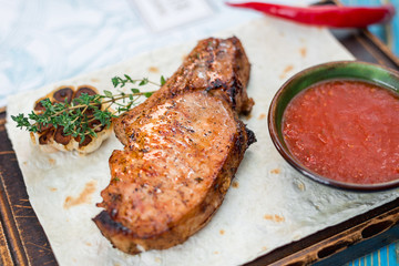 steak with sauce on a pita bread sheet