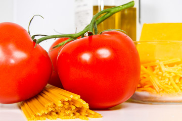 Mediterranean diet of Tomatoes, Pasta, Cheese and Olive Oil.