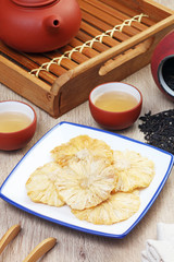 Dried pineapple on the wooden table             