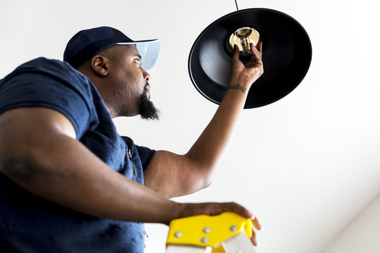 Man Changing Light Bulb 