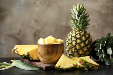 Fototapeta na wymiar Composition with fresh sliced pineapple on table