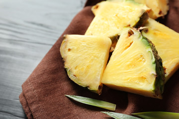 Fresh sliced pineapple on napkin, closeup