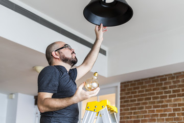 Man changing lightbulb