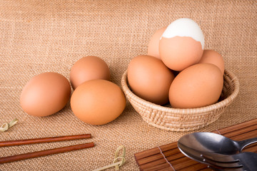 Set Eggs in a basket on  gunny (sackcloth)  background