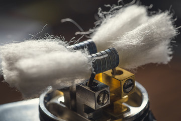 Vape device or dripping RDA without top cap, coils and cotton fore vapour clouds. Electronic e -...