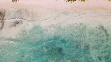 white sand and blue ocean. calm water