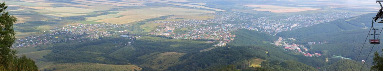 Beautiful summer panorama from Mount Tserkovka to resort of Belokurikha in the Altai Krai