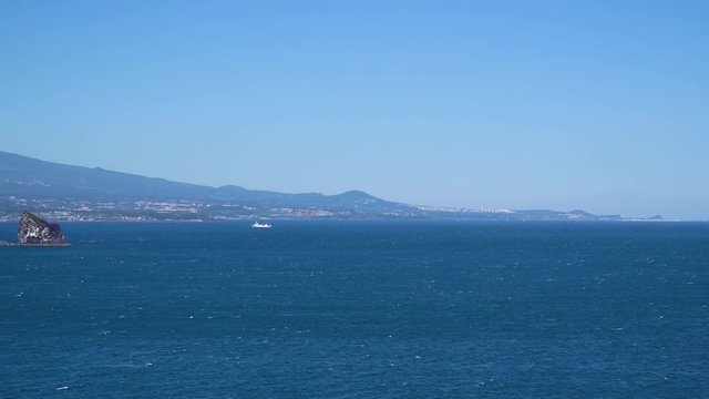 Landscape of southwestern coast of Jeju Island with Sanbangsan and Hallasan mountain, viewed from Olle trail No.10 at Songaksan mountain.
